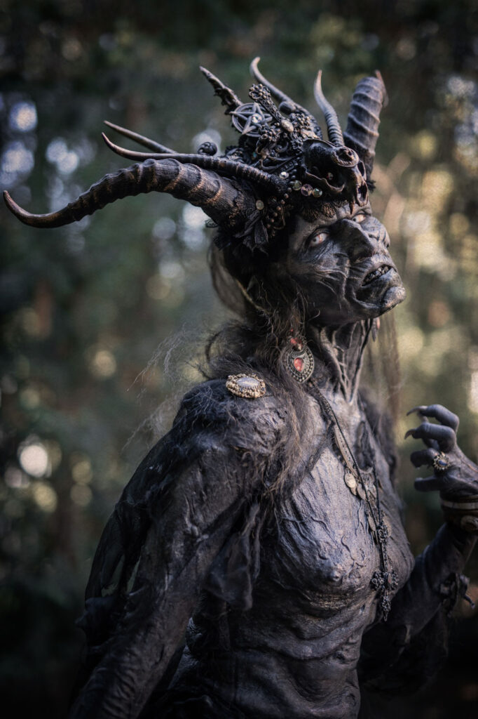 SFX makeup of the Mother of Lies creature featuring large twisted horns and detailed skin textures, created by Vlad Taupesh and Jozef Rarach.